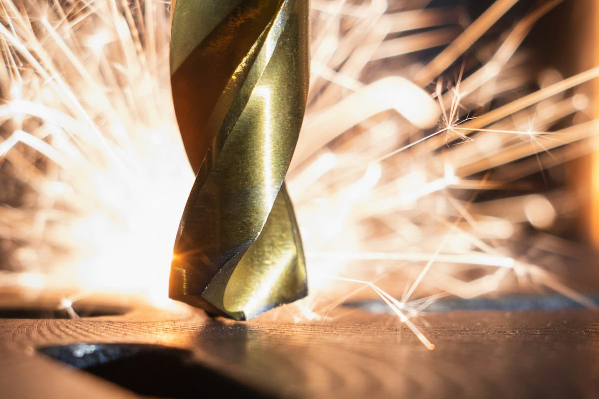 Drill bit cutting metal with sparks