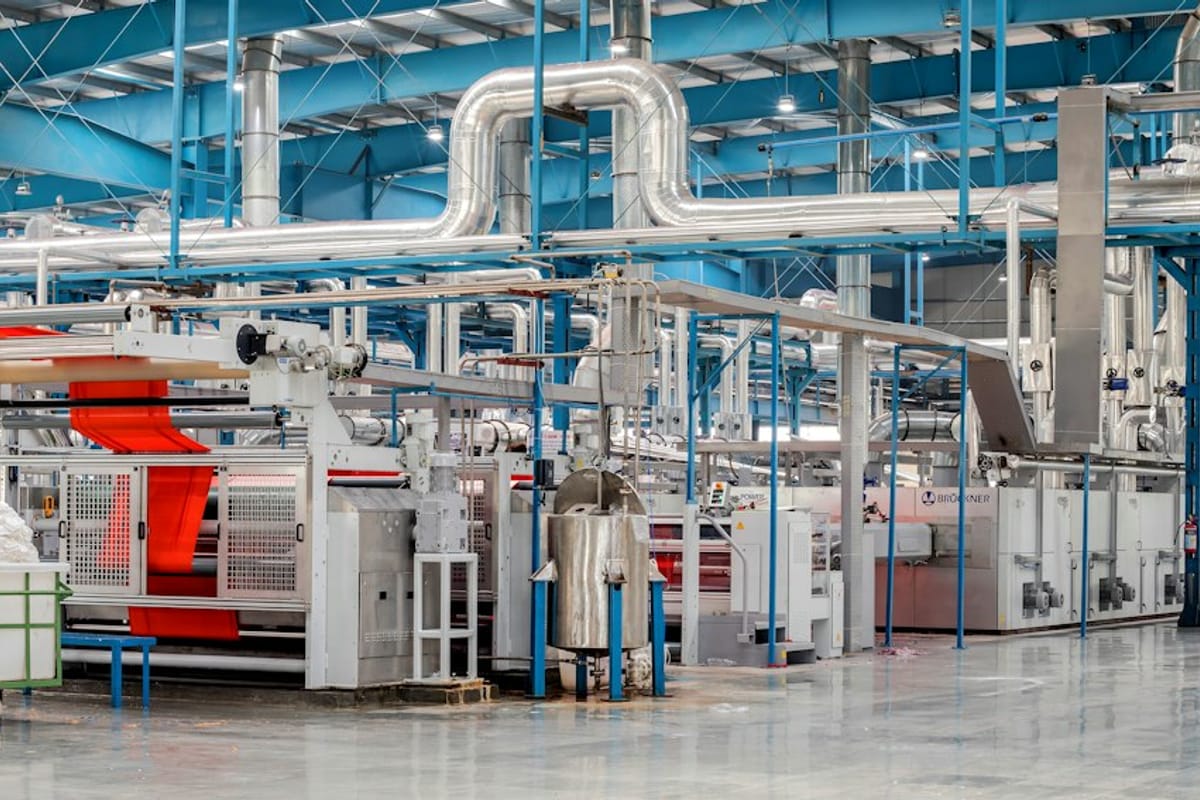 Factory interior with machinery and pipework